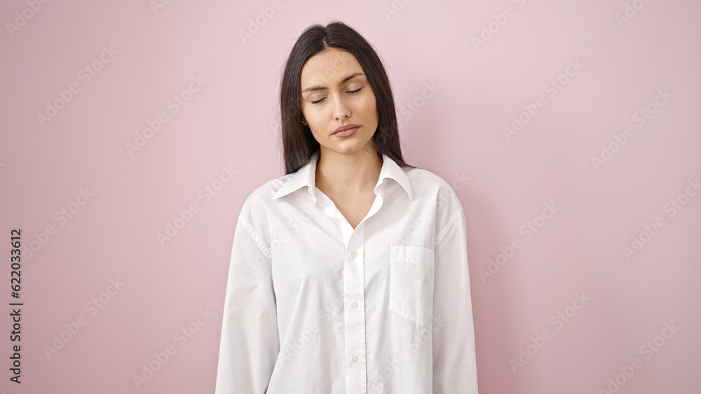 Young beautiful hispanic woman standing with relaxed expression over isolated pink background Young beautiful hispanic woman standing with relaxed expression over isolated pink background