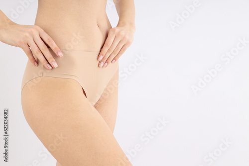 Close-up of a girl's figure on a light background