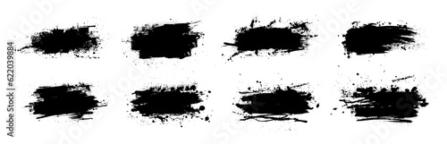 Black dried paint splattered in dirty style. Isolated black ink stencils for graphic design, text fields. Artistic texture of ink brush strokes, splatter stains, callout. Paintbrush, stroke vector set photo