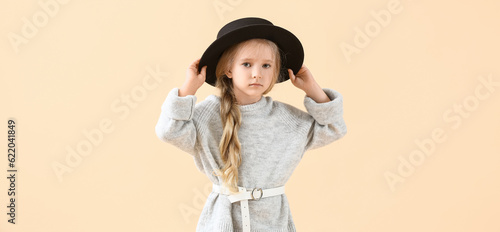 Cute little girl in stylish...