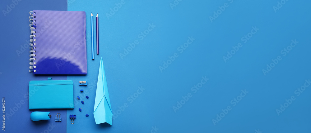 Paper plane with school supplies on blue background with space for text Paper plane with school supplies on blue background with space for text
