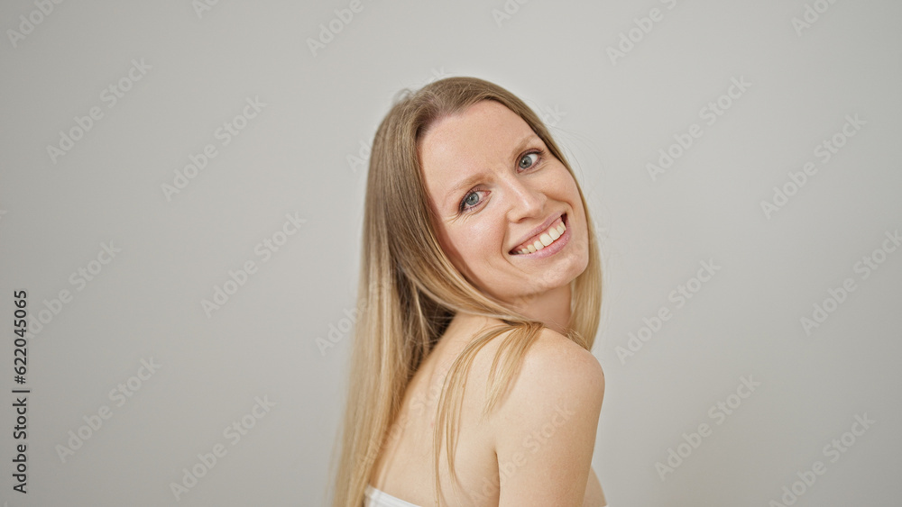 Young blonde woman smiling confident standing over isolated white background Young blonde woman smiling confident standing over isolated white background