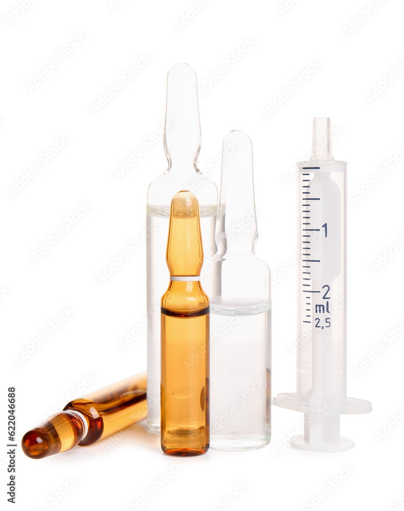 Ampules with syringe on white background Ampules with syringe on white background