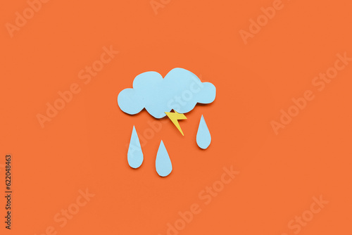 Paper cloud with rain drops and lightning on red background. Weather forecast concept