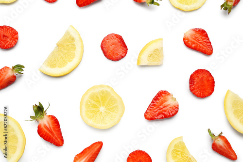 Fototapeta Naklejka Na Ścianę i Meble -  Slices of strawberry and lemon for preparing lemonade on white background