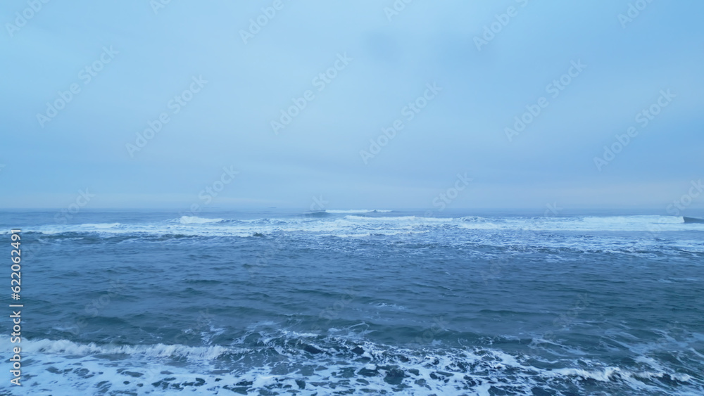 Icelandic scenery black sand beach with ocean coastline, beautiful arctic country with natural landscape. Aerial view of iceland nature with waves crashing on atlantic shore. Slow motion. Icelandic scenery black sand beach with ocean coastline, beautiful arctic country with natural landscape. Aerial view of iceland nature with waves crashing on atlantic shore. Slow motion.