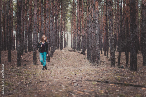 Photo of a beautiful girl, located in the forest