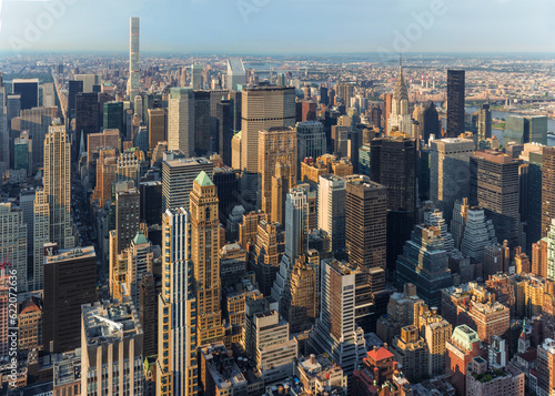 New York City Manhattan street aerial view with skyscrapers  pedestrian and busy traffic. Sun at sunset.