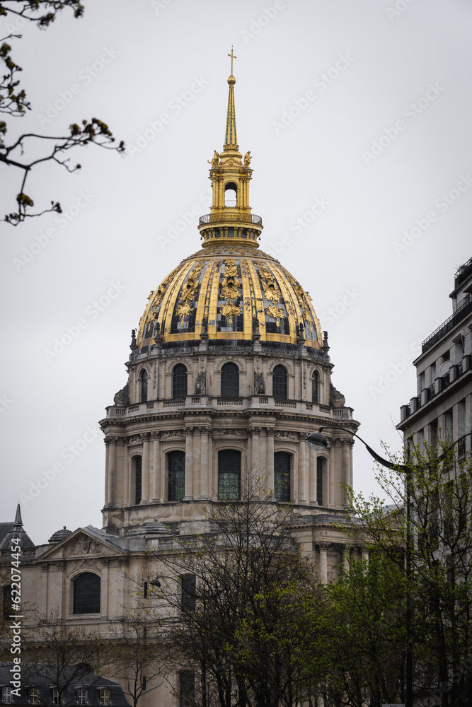 Saint Louis des Invalides Cathedral, the place where the tomb of Emperor Napoleon Bonaparte is. The facade is adorned with impressive columns, ornate details, and intricate sculptures. 