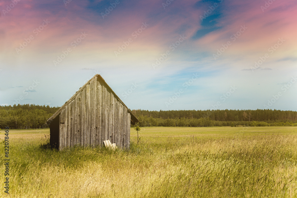 Old village house in a field. Cabin in the country Old village house in a field. Cabin in the country