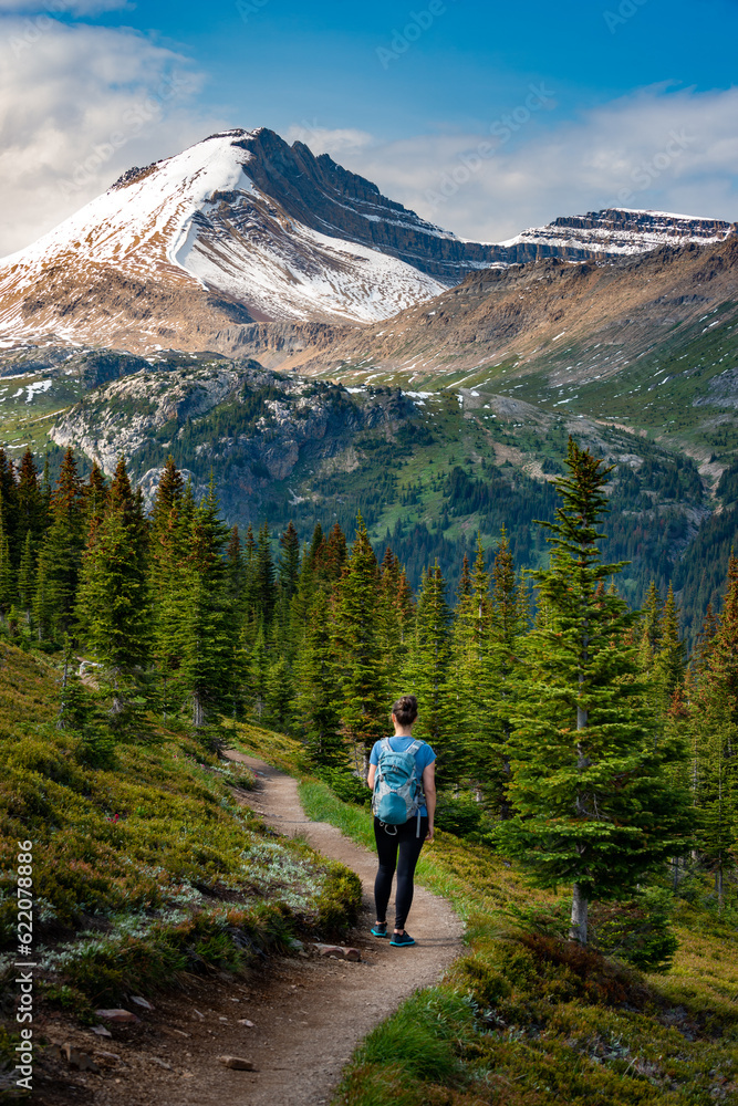 Backpacker woman on a hiking trail to Cirque Peak via Helen Lake, Alberta Canada Banff National Park
