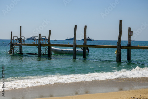 Crystal clear blue water of legendary Pampelonne beach near Saint-Tropez  summer vacation on white sandy beach of French Riviera  France