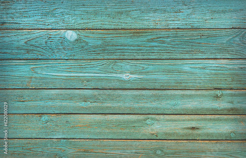 Green wall wooden texture as background. Closeup