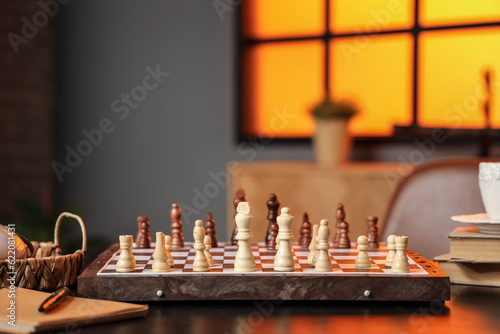 Wallpaper Mural Game board with chess pieces on table in room, closeup Torontodigital.ca