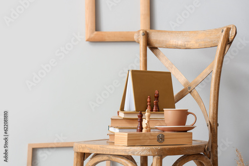 Books with chess pieces and...