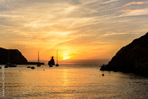 Quiet scene  Sailboats in a harbor at sunset. Mediterranean sea of Ibiza island