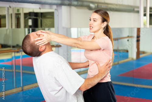 Self-defense course - woman strikes painful blow in the eyes of a man