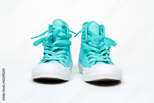 pair turquoise shoes isolated on white background