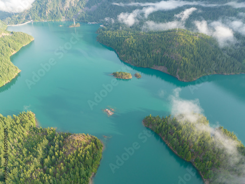 Rugged  forest-covered landscape surrounds Diablo Lake in North Cascades National Park. This mountainous region of northern Washington is absolutely beautiful and easily accessed during summer months.