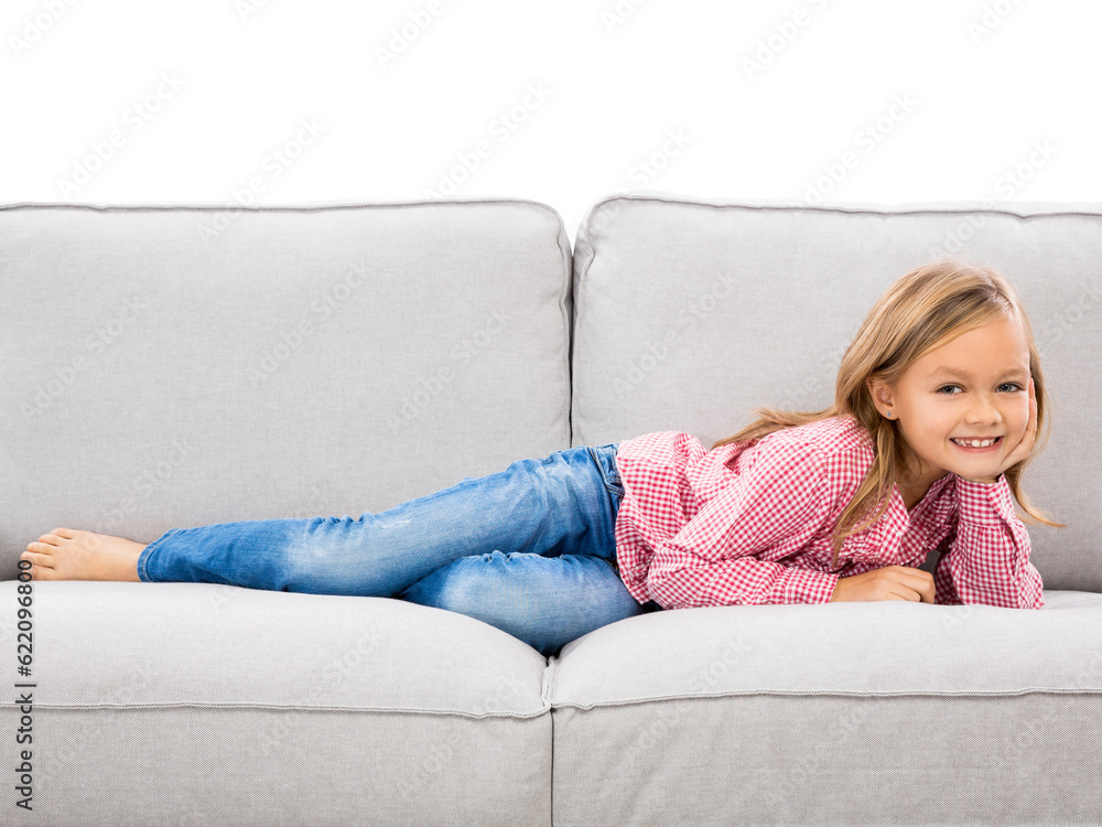 Little girl at home lying on a couch Little girl at home lying on a couch