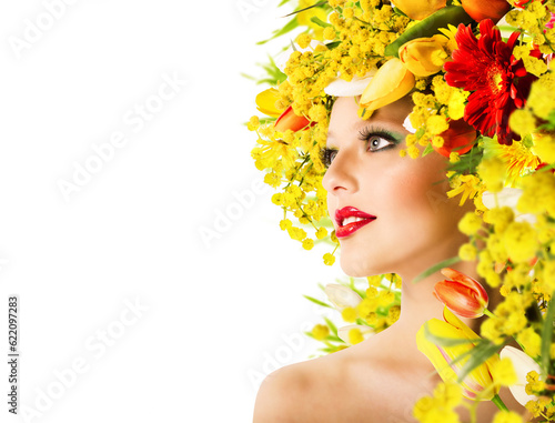 Model with hairstyle with flowers and makeup