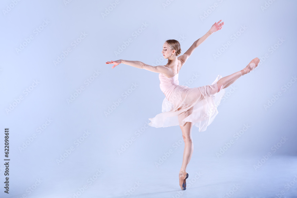 Young ballerina is dancing in a white studio full of light Young ballerina is dancing in a white studio full of light