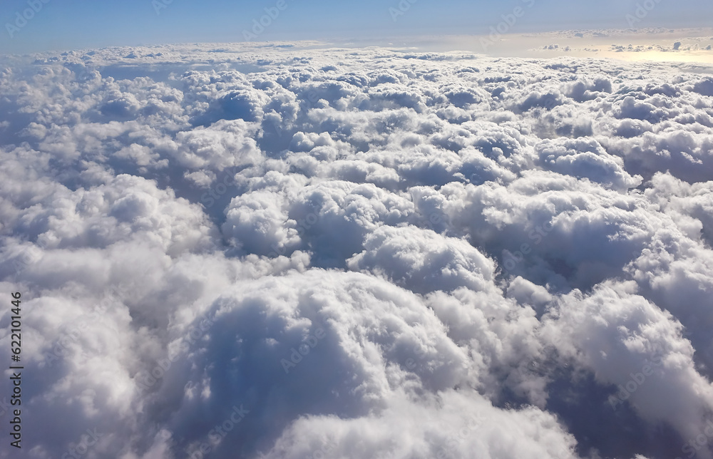 Sunrise with blue sky and white cloud from plain in atmosphere