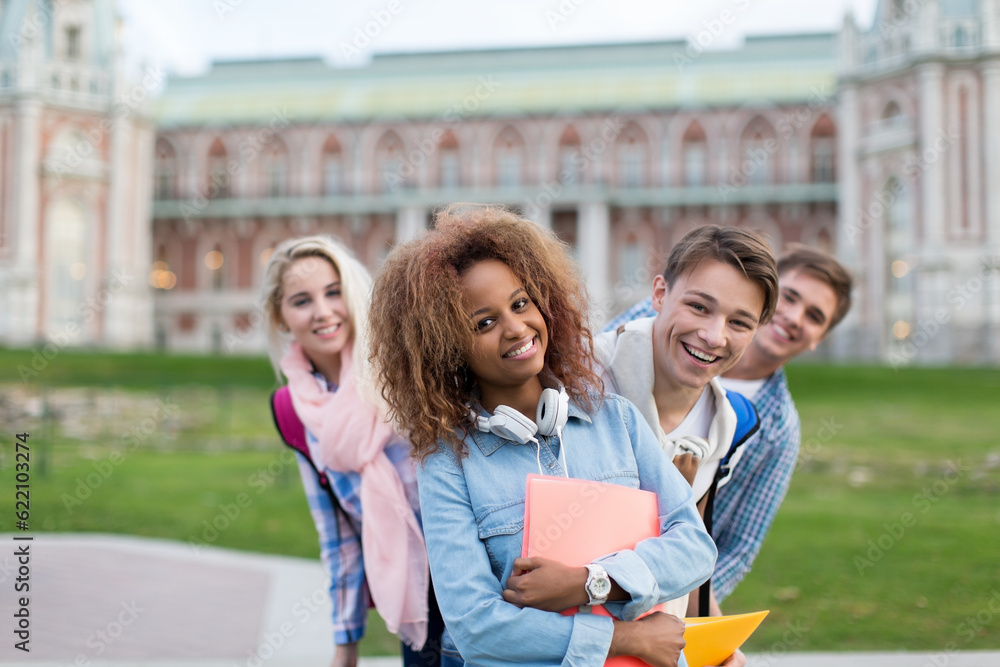 Smiling students on campus outdoors Smiling students on campus outdoors