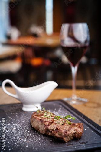 New York steak with glass of red wine