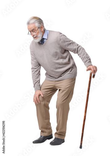 Tired senior man with walking cane on white background