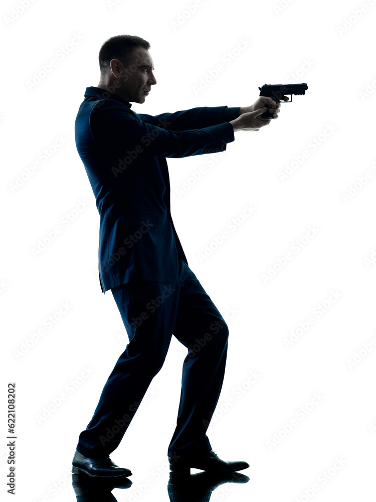 one caucasian man with a handgun silhouette isolated on white background one caucasian man with a handgun silhouette isolated on white background