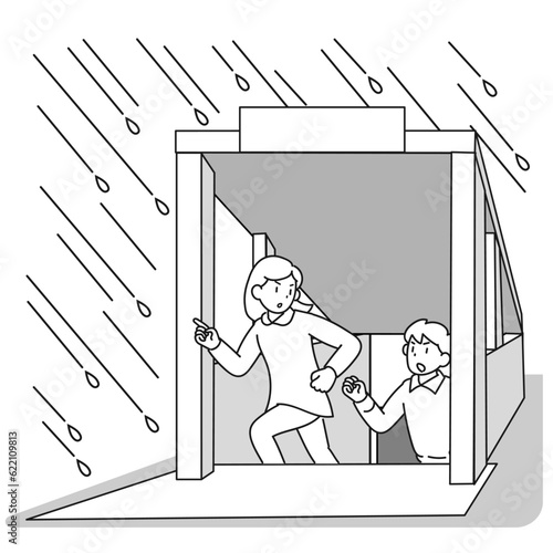 大雨のときに急いで地下から地上へ出る人々