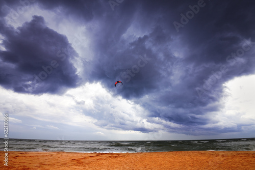 Power kite in sea and storm sky. Wide angle view. photo