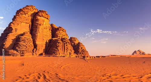 beautiful rock mountains in the middle of the desert with a BLUE sunset