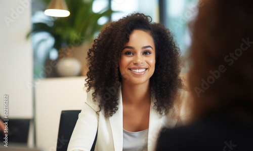 female african business woman smiling and working with client. Business meeting concept