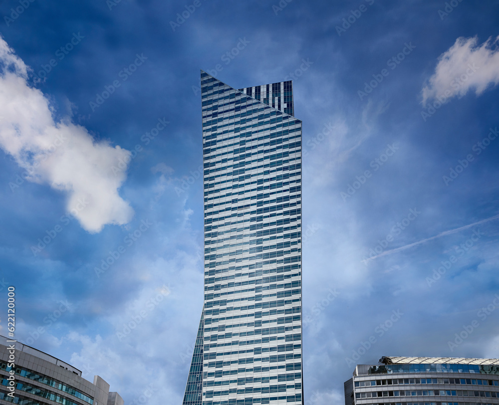 Obraz premium Modern residential skyscraper at dark blue sky. Copy space.
