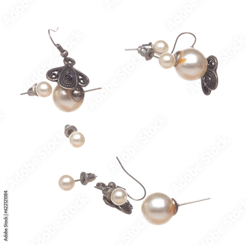 Fashion pearl Earrings with beautiful work detail is value. Luxury deep sea pearl diamond earring is fashion trend and fly in air. White background isolated