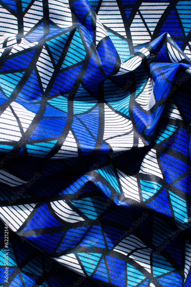 top view of blue and white ankara fabric, flatlay of nigerian wax cloth, rumpled blue and white ankara material top view of blue and white ankara fabric, flatlay of nigerian wax cloth, rumpled blue and white ankara material