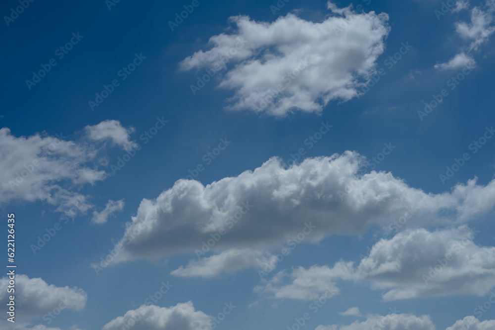 Big white fluffy cumulous clouds on blue sky Big white fluffy cumulous clouds on blue sky