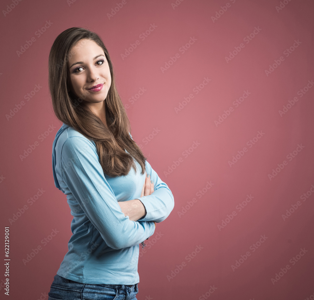 Young confident woman smiling with arms crossed Young confident woman smiling with arms crossed