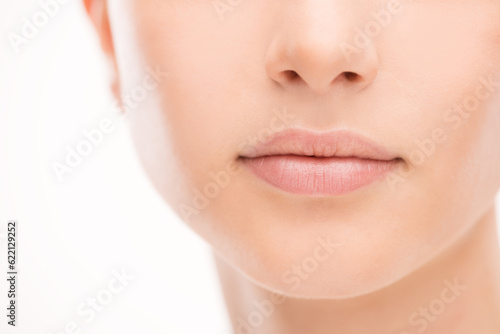 Beautiful young woman's full lips close-up, perfect skincare concept