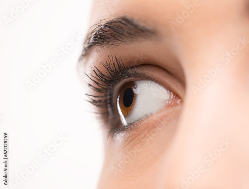 Fototapeta Naklejka Na Ścianę i Meble -  Beautiful woman's brown eye close up looking away