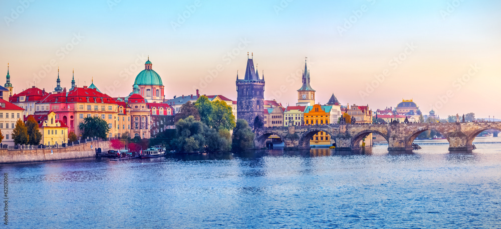 Fototapeta premium Sunset landscape view to Charles bridge on Vltava river in Prague Czech republic