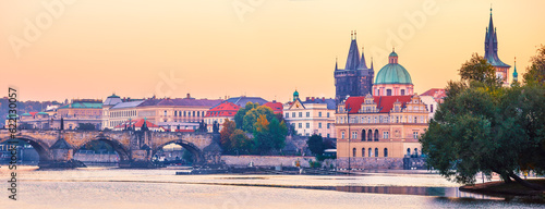 Sunset landscape view to Charles bridge on Vltava river in Prague Czech republic