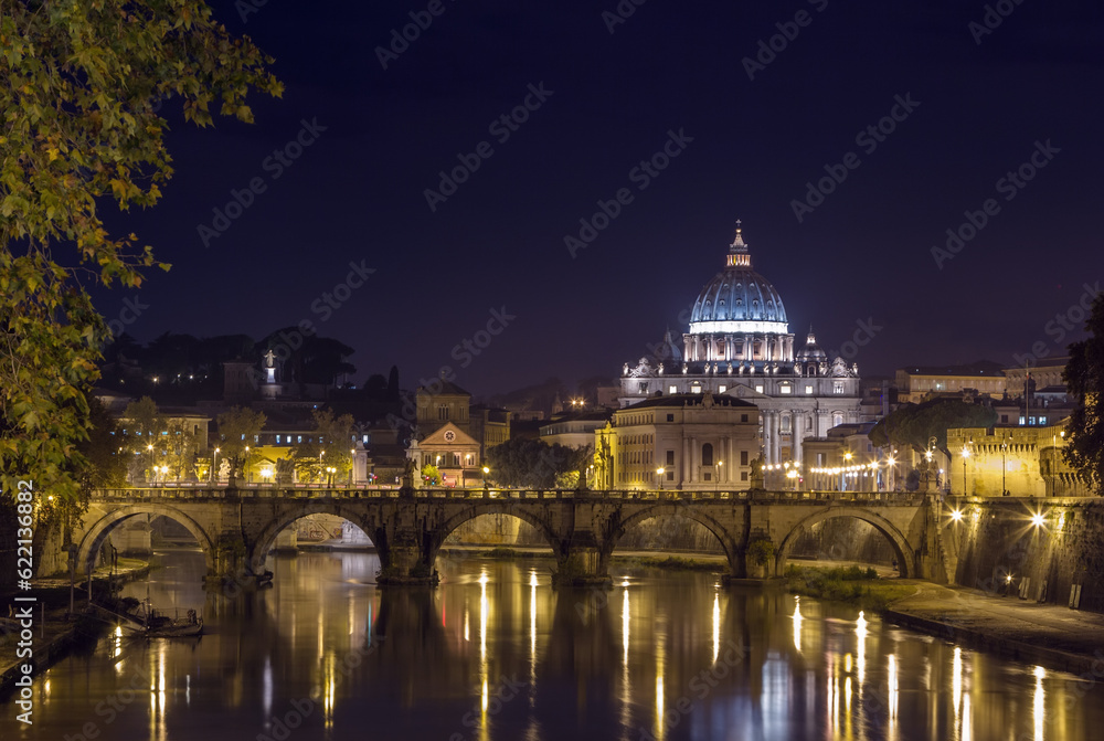 view of Ponte Vittorio Emanuele II and St. Peter's Basilica in evening, Rome