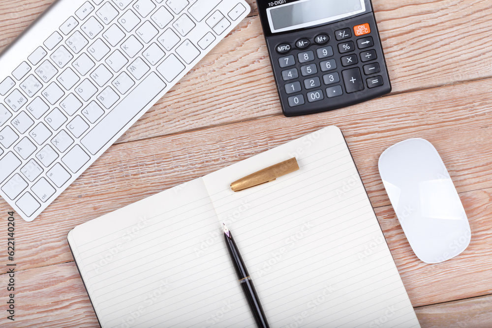 Business concept photo: keyboard, calculator, paper, ink pen on wooden background Business concept photo: keyboard, calculator, paper, ink pen on wooden background