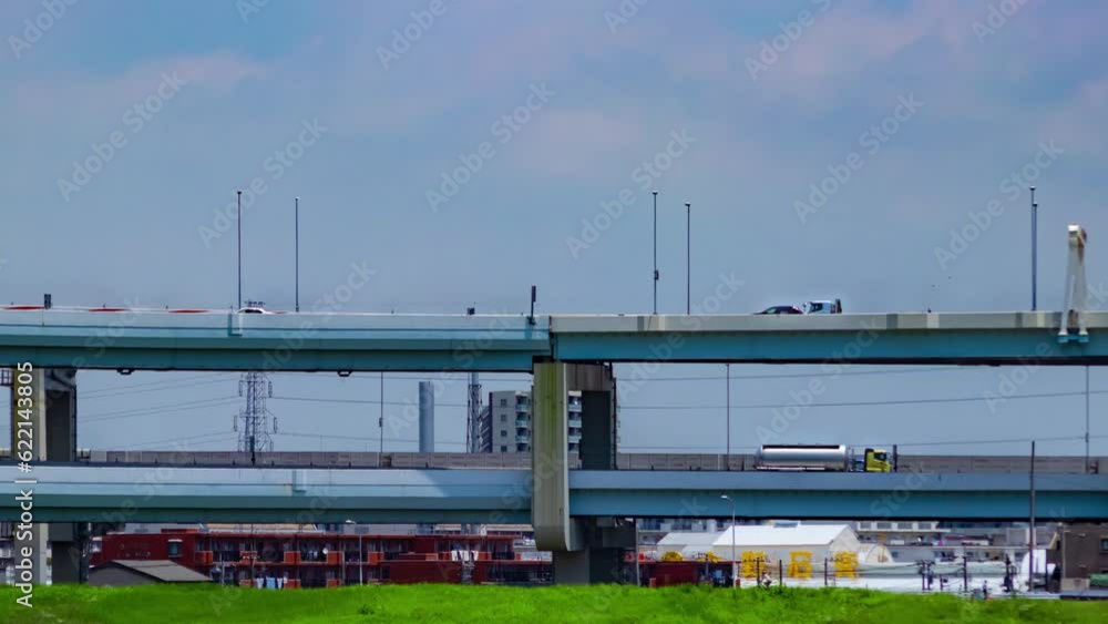 A timelapse of traffic jam at the downtown street and highway telephoto shot panning A timelapse of traffic jam at the downtown street and highway telephoto shot panning