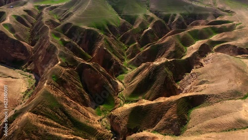 Aerial Tilt Down Shot Of Hills And Mountain Ranges On Sunny Day, Drone Flying Forward Over Natural Landscape - Nabi Musa, Israel