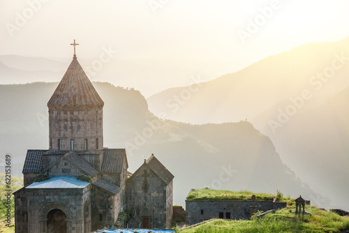 Ancient monastery in setting sun. Tatev. Armenia