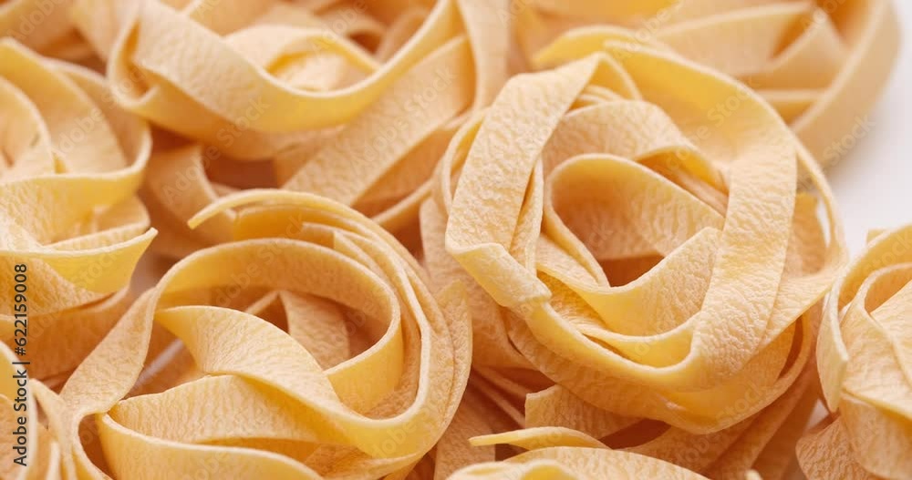 pasta backgroud - macro view of Dry Authentic Italian fettuccine pasta backgroud - macro view of Dry Authentic Italian fettuccine